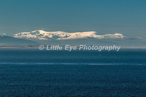 Point of Ayr Lighthouse with Snowdonia beyond. Taken from Hilbre