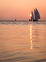Sunset sailing reflections