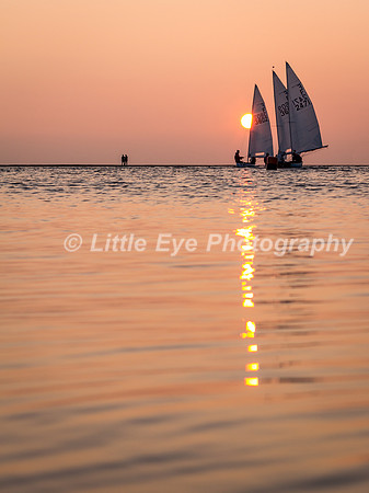 Sunset sailing reflections